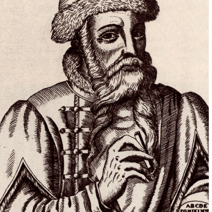 Bearded man in Renaissance robes and fur hat. 