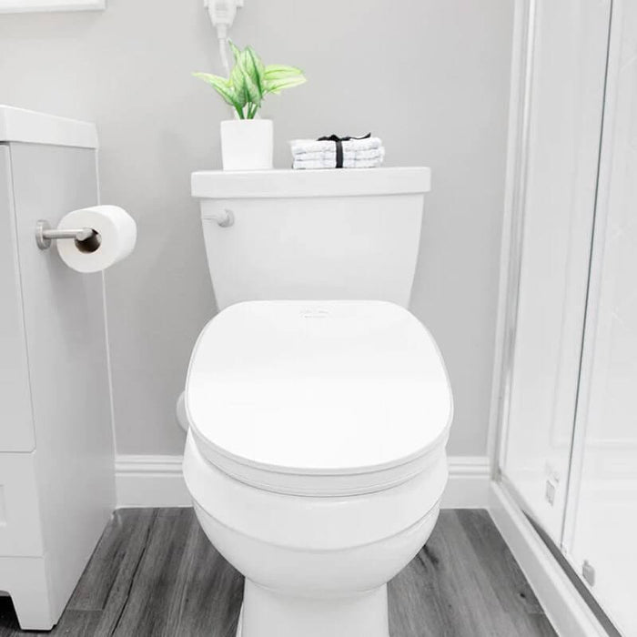 Bright modern bathroom with toilet and shower.