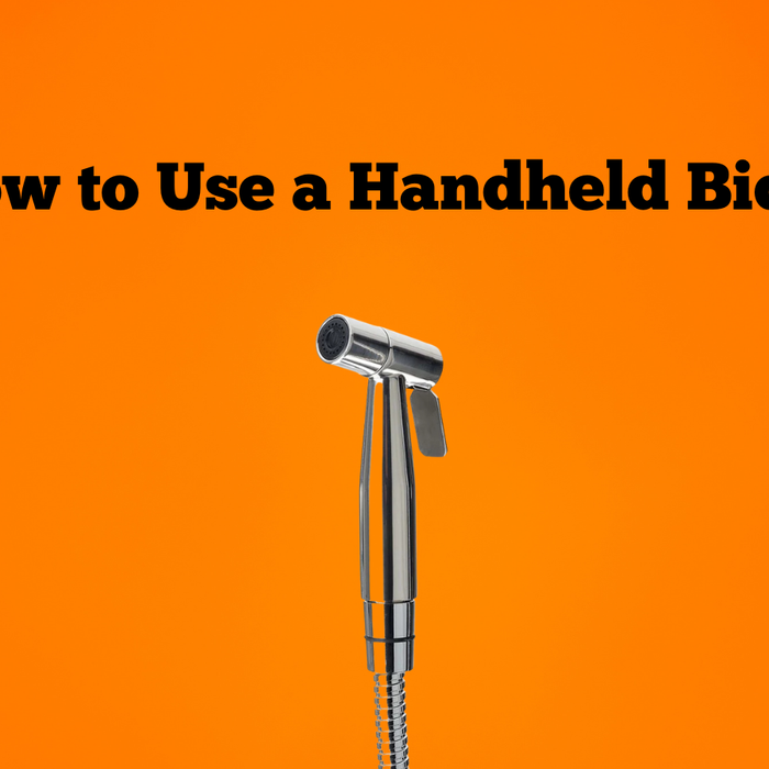 how to use a handheld bidet orange background bidet sprayer side view