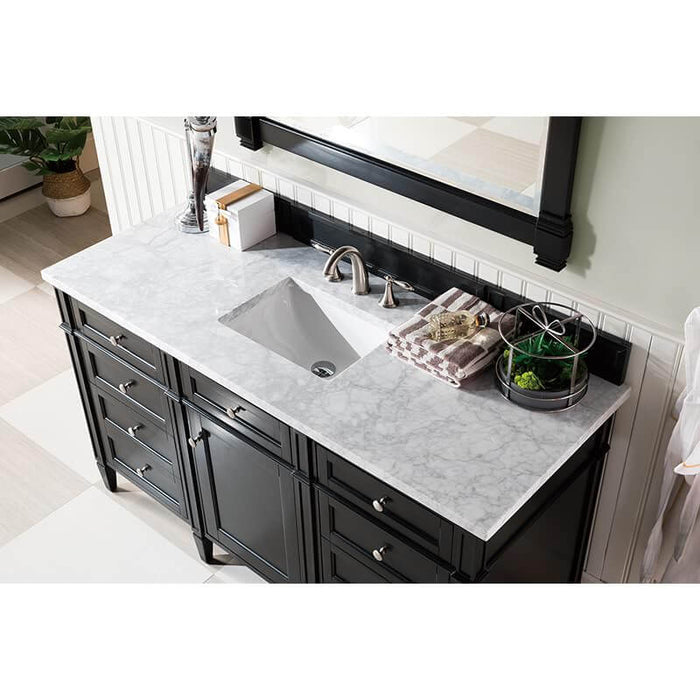 Black vanity with white marble top.
