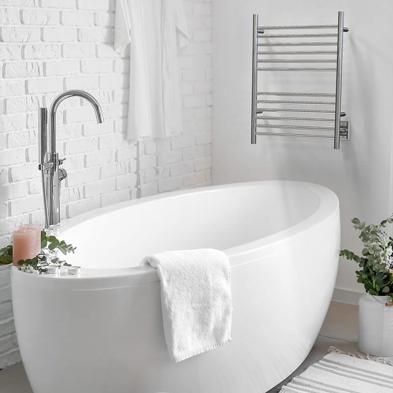 Amba Cape Model 2332 Towel Warmer in Polished Stainless Mounted Infront of Bathtub