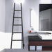 Amba Jeeves Model a Ladder 5 Bar Hardwired Drying Rack in Matte Black Front View Beside Vanity Cabinet