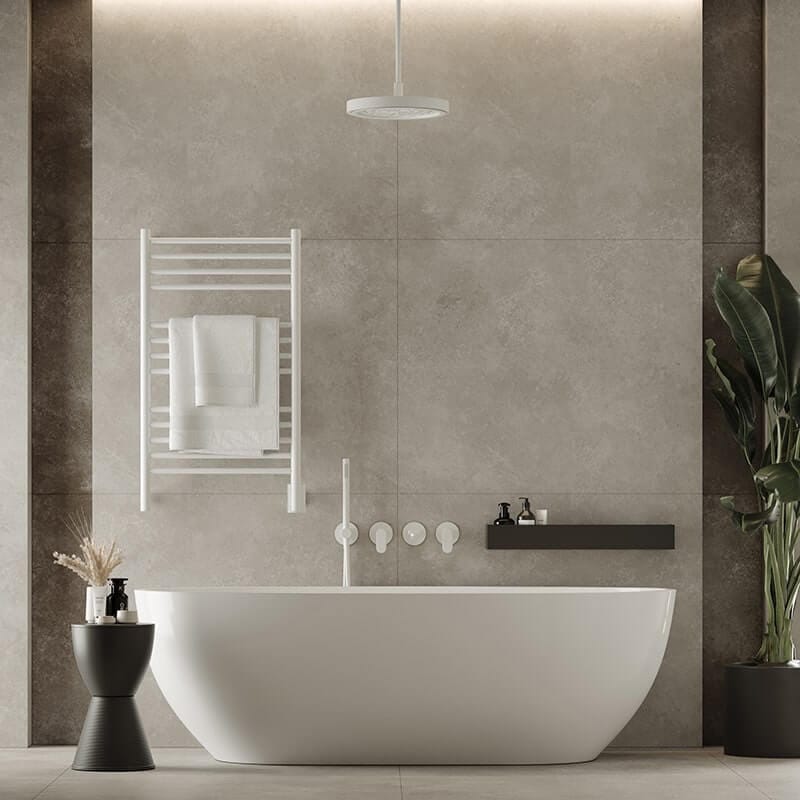 Amba Jeeves Model C Straight 13 Bar Hardwired Towel Warmer in White Behind a Bathtub