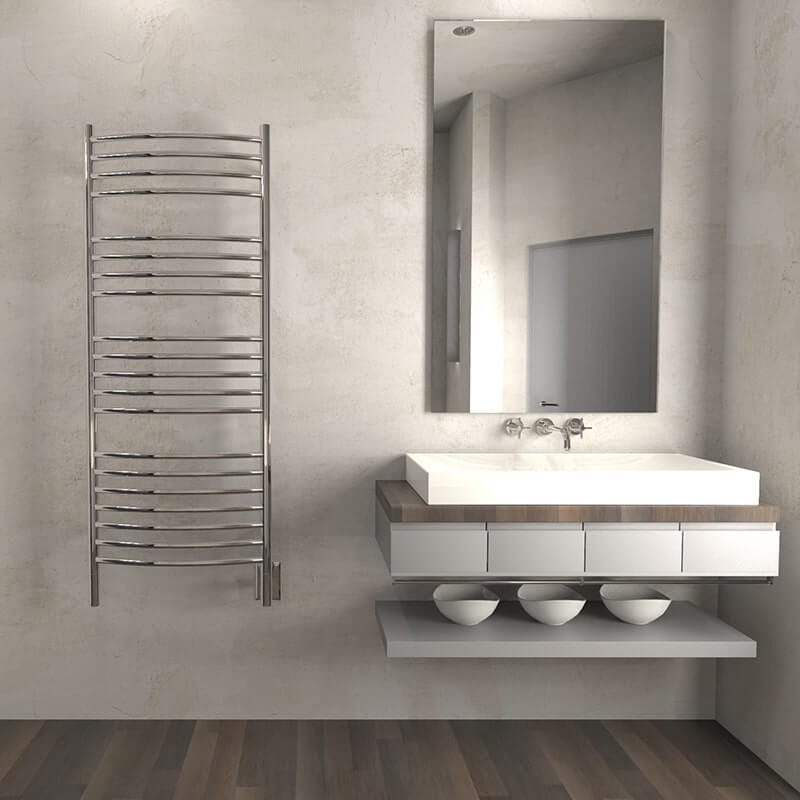 Amba Jeeves Model D Curved 20 Bar Hardwired Towel Warmer in Polished Stainless Beside Vanity