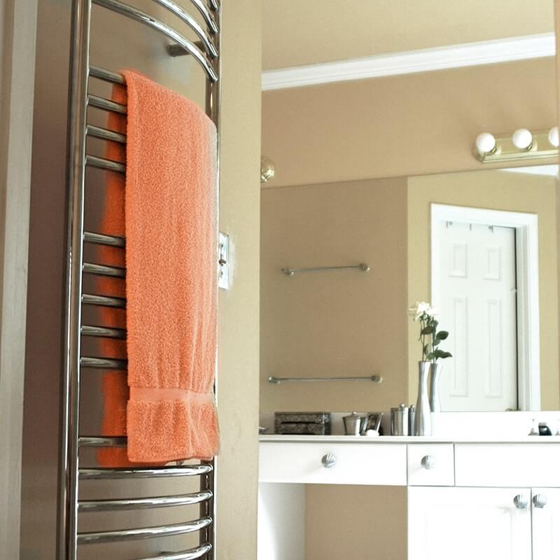 Amba Jeeves Model D Curved in Polished Stainless Side View With Orange Towel