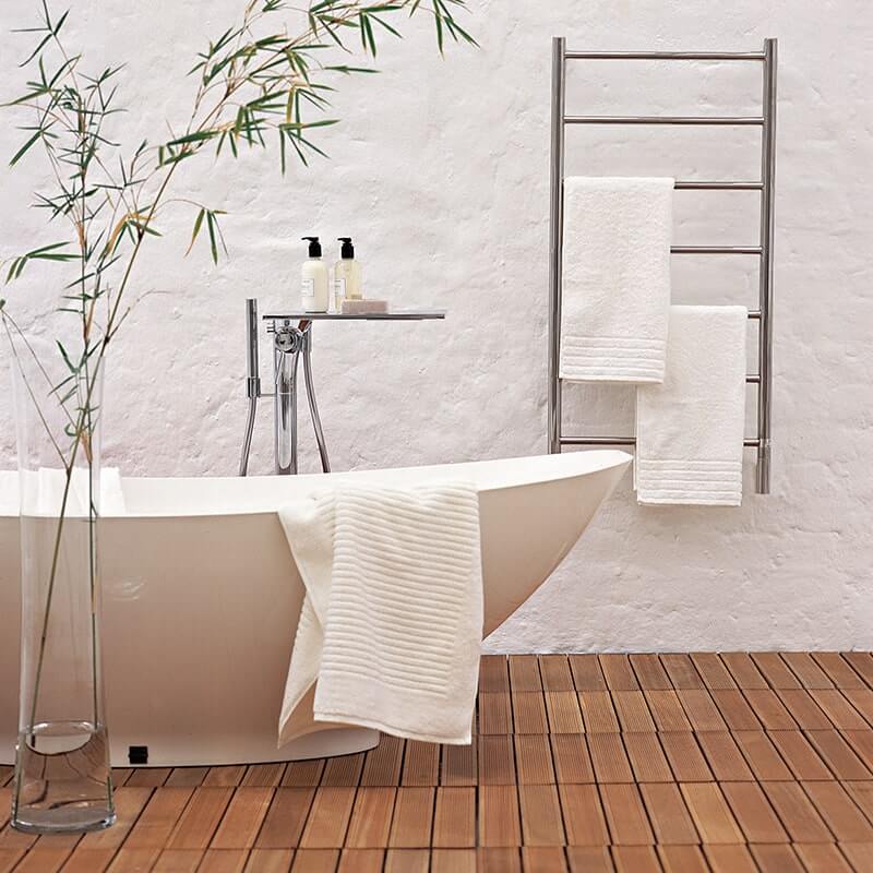 Amba Jeeves Model F Straight in Polished Stainless Mounted Behind a Bathtub