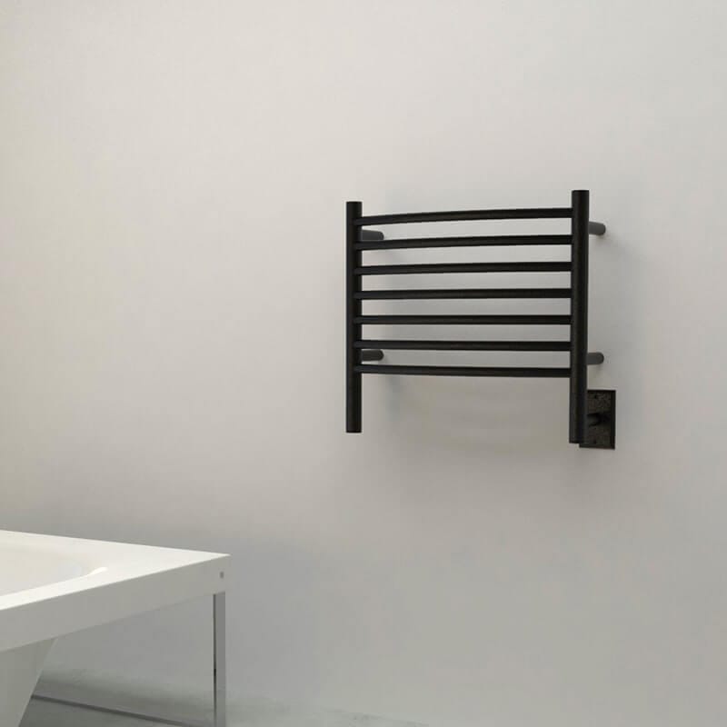Amba Jeeves Model H Curved 7 Bar Hardwired Towel Warmer in Matte Black Near Bathtub