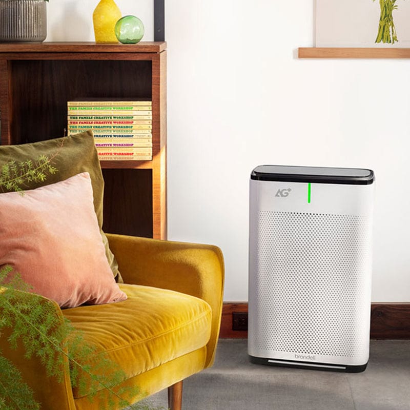 brondell pro sanitizing air purifier with yellow chair