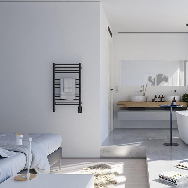 Jeeves Model C Straight Towel Warmer in Matte Black Front View Near Bed