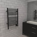 Jeeves Model E Curved 12 Bar Towel Warmer in Matte Black Corner View Lifestyle