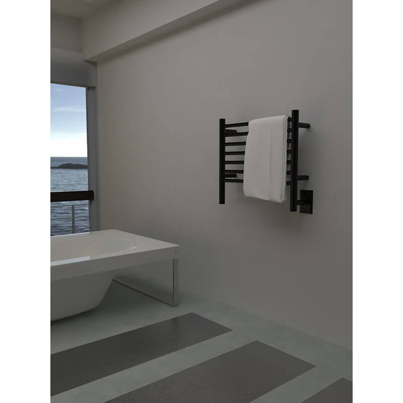 Jeeves Model H Straight Towel Warmer in Matte Black Near a Bathtub