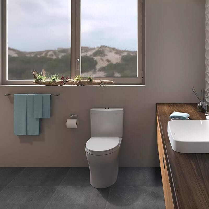 toto aquia iv two piece toilet 1.28 gpf 0.9 gpf universal height front view lifestyle