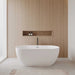 Wyndham Collection Juno 63" Freestanding Acrylic Matte White Bathtub With Polished Chrome Trim and Matte Black Faucet Lifestyle
